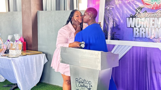 Claudine Smith-Wright (left) shares an emotional moment with her mother, Jacqueline Wilks, during the International Women’s Day Brunch hosted by the South St. Catherine Chamber of Commerce at Rooftop Lounge in Old Harbour on Sunday.