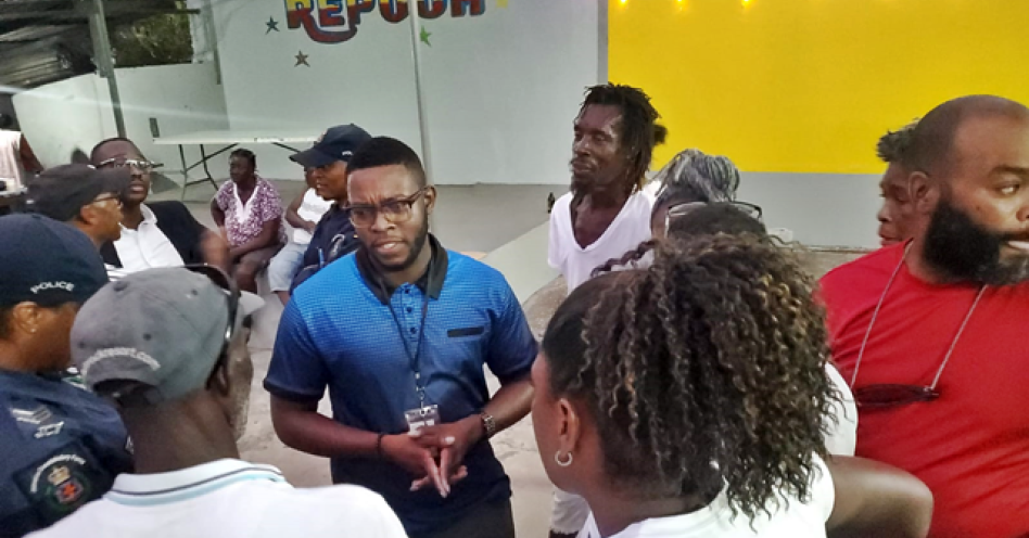 Caption: ASP Romario Rankin (centre) in discussion with residents and entrepreneurs in Old Harbour Bay on March 12, 2025. (OH News Photo)