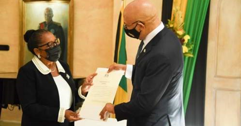Governor-General, Sir Patrick Allen (right), presents Icylin Golding (left) with the Instrument of Appointment as Custos Rotulorum for the parish of St Catherine in a swearing in ceremony held at King's House on Friday, September 24. (Photo contributed)