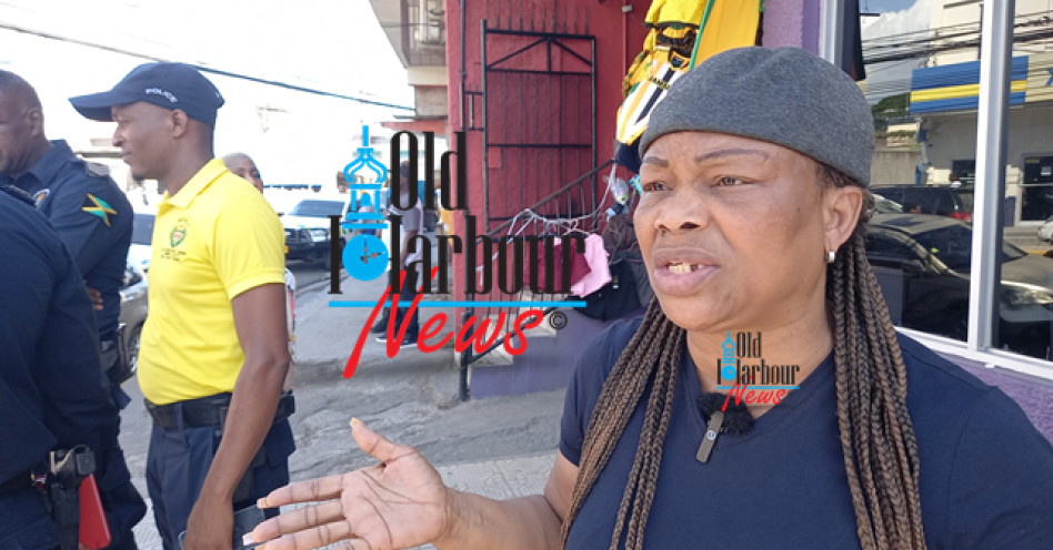 Martha Spencer, wife of slain pastor Michael Spencer speaking to the media yesterday in Old Harbour. (OH News Photo)