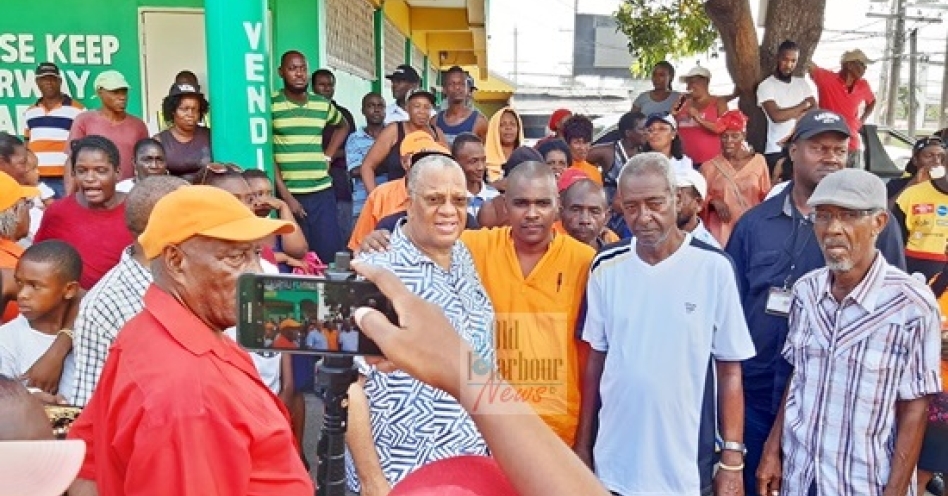 PNP president Dr Peter Phillips and Dr Kurt Waul in Old Harbour today. (OH News Photo)