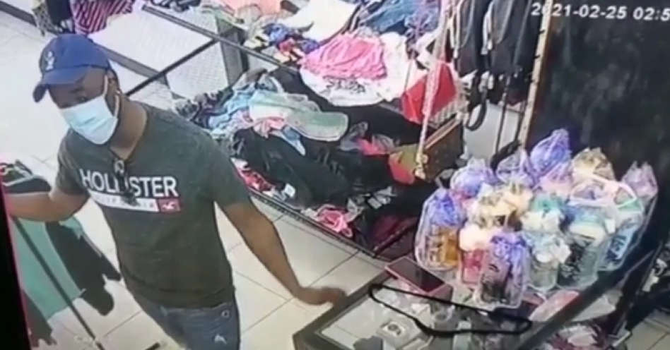 A screenshot of the culprit about to steal a phone inside the LS Dress For Less store on Darlington Drive.