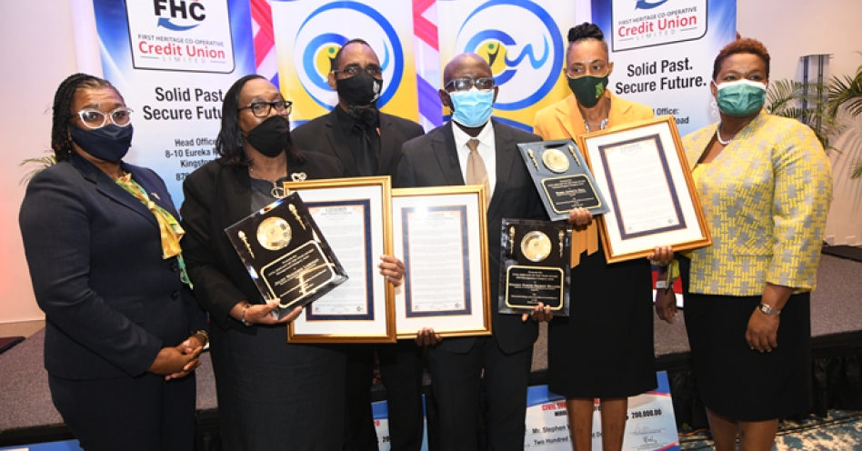 1st Vice Chairman, Leodis Douglas (left) and CEO, Roxann Linton (right) of First Heritage Co-operative (FHC) Credit Union, along with Chairman of FHC’s Board of Directors and President of the Jamaica Civil Service Association, O’Neil Grant (3rd from left) with the 2020-2021 winners of the FHC Civil Servants of the Year Awards: (l-r) Director of Human Resource Management in the Ministry of Education, Youth and Information, Juliet Lakeman (Management); Clerk of Court at the Trelawny Parish Court, Stephen Williams (Middle Management); and Senior Secretary at St. Jago High School, Marie Hall (Technical Support).