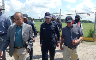 Security Minister Dr Horace Chang leading a team of high officials when he visited the community of Spring Village. (IH News Photo)